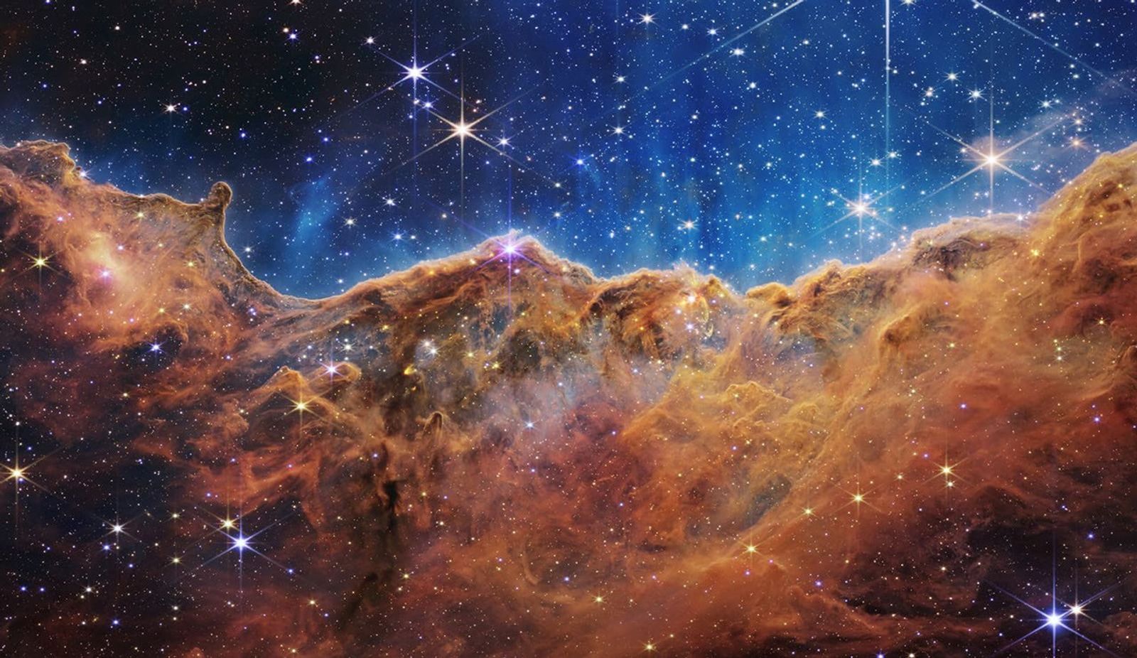 JWST view of the Cosmic Cliffs in NGC 3324, with newly forming stars carved out of a dusty stellar nursery